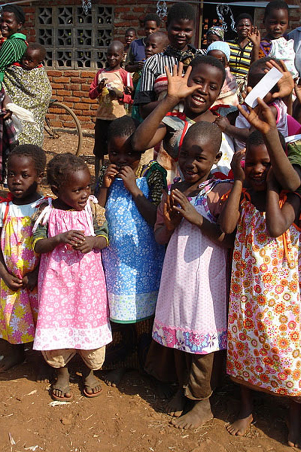 African girls wearing pillowcase dresses